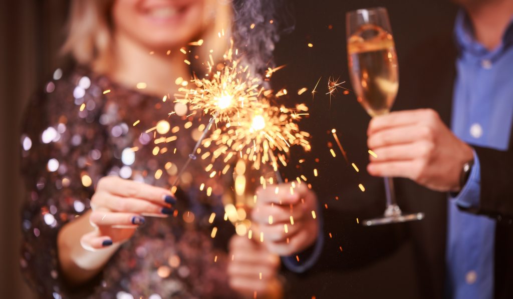 Image,Of,Couple,With,Champagne,Glasses,And,Sparklers,On,Black › Blog Bestravel